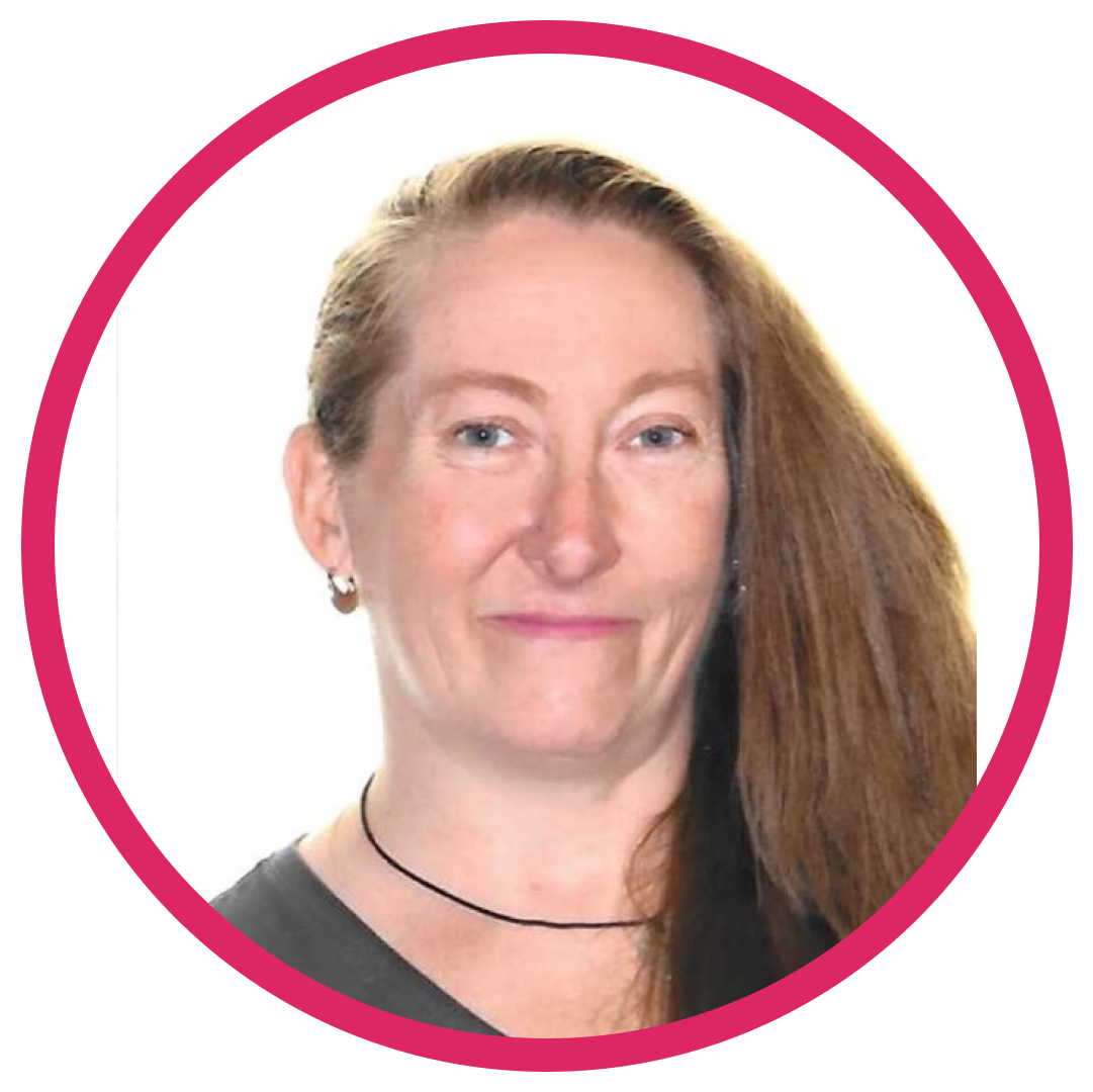 Portrait of Donna B, a woman with long, straight light brown hair, wearing a black top and small hoop earrings, set inside a circular frame with a pink border.